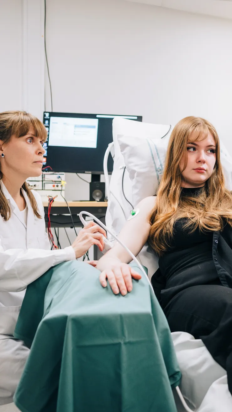 Closeup. Researcher uses ultrasound on an arm.